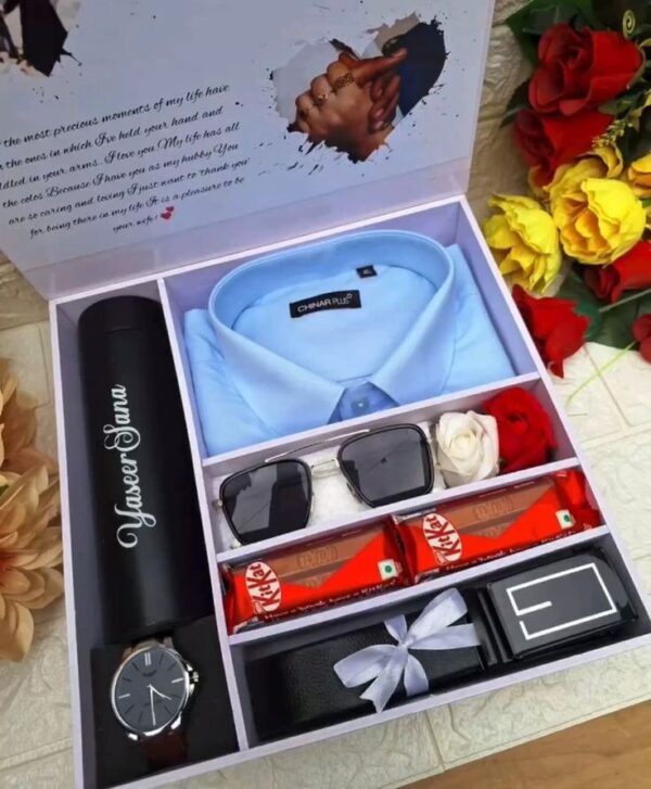 Men's gift box with a shirt, belt, watch, sunglasses, chocolates, a personalized thermos, and decorative roses.