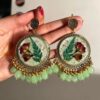 Handcrafted green floral earrings with real dried flowers and beads.